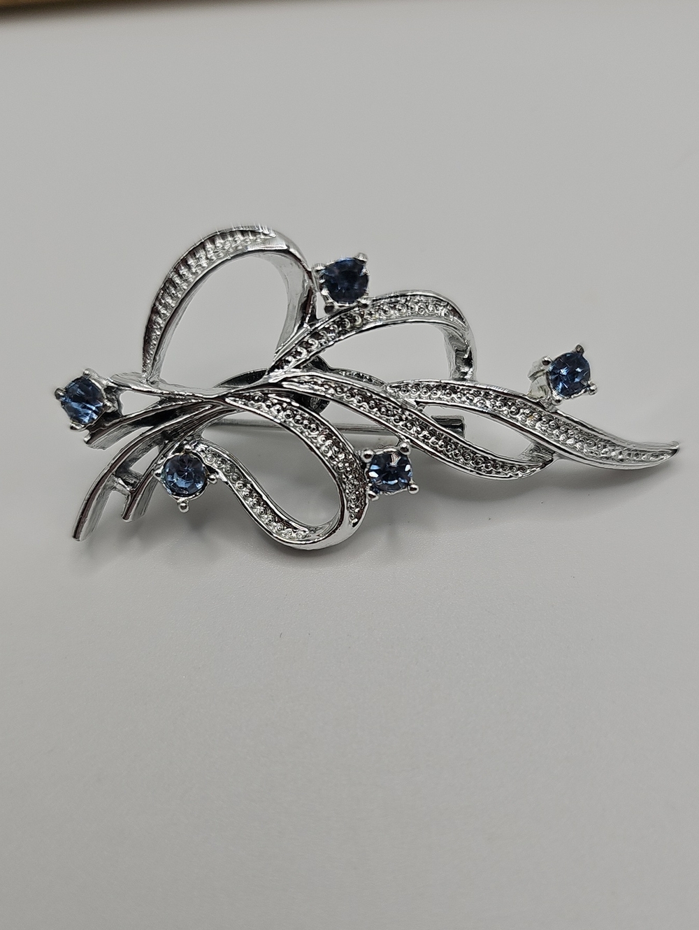 Vintage Gerrys Silver-Tone Blue Crystal Ribbon Brooch